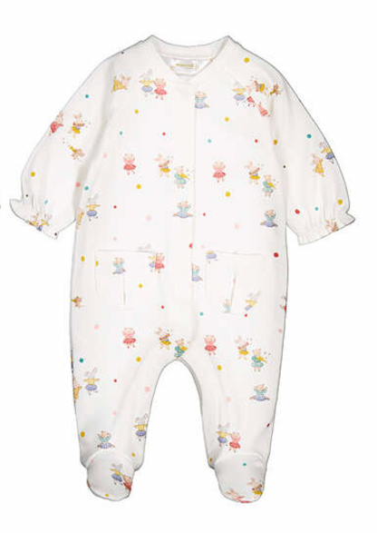 A baby footed one-piece jumpsuit in white, featuring an all-over print of small cartoon characters in various colorful outfits and scattered pastel polka dots.