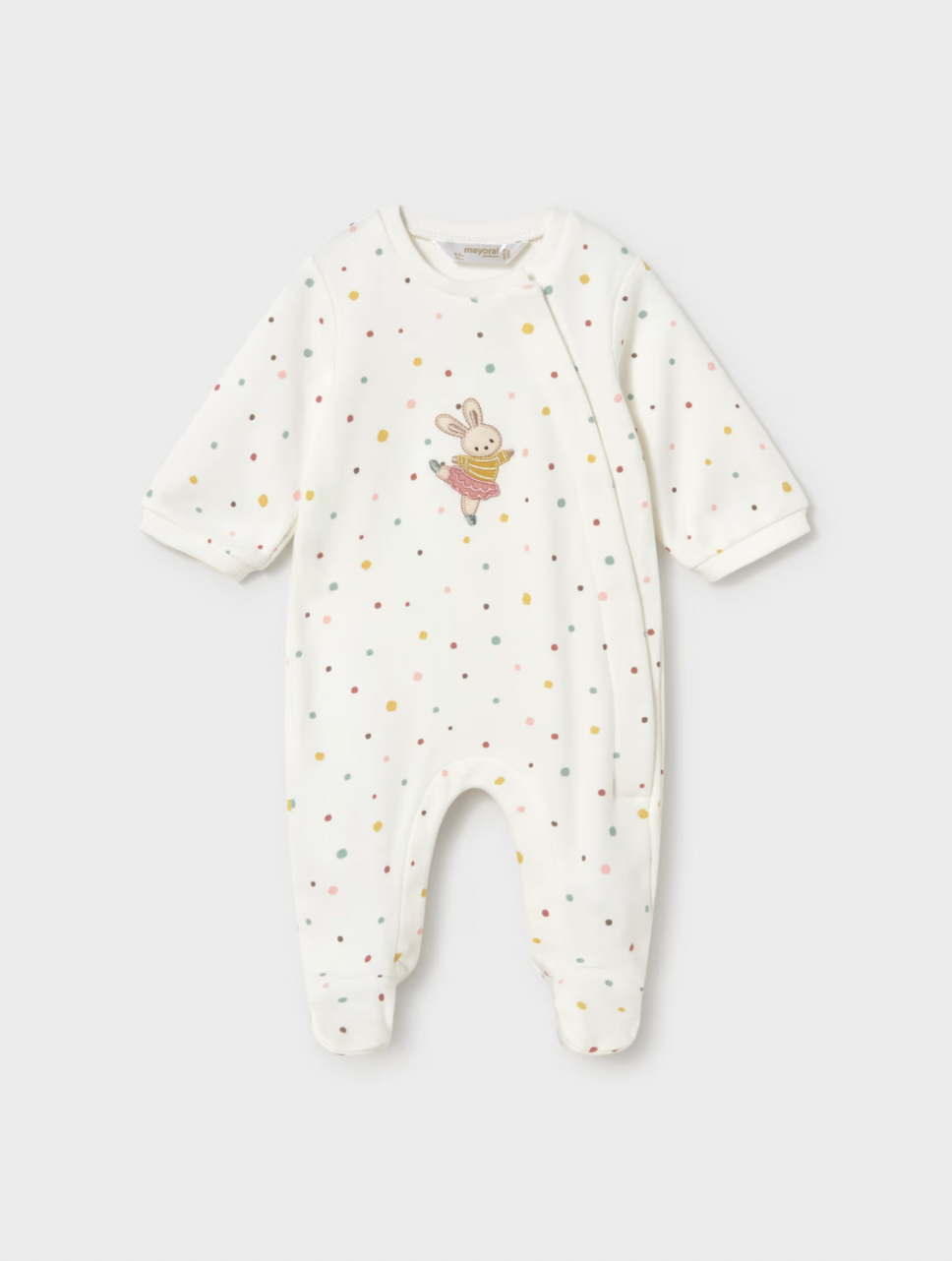 A baby long-sleeve footless sleeper in off-white, decorated with small multicolored polka dots and a cute bunny graphic on the chest, shown against a light gray background.