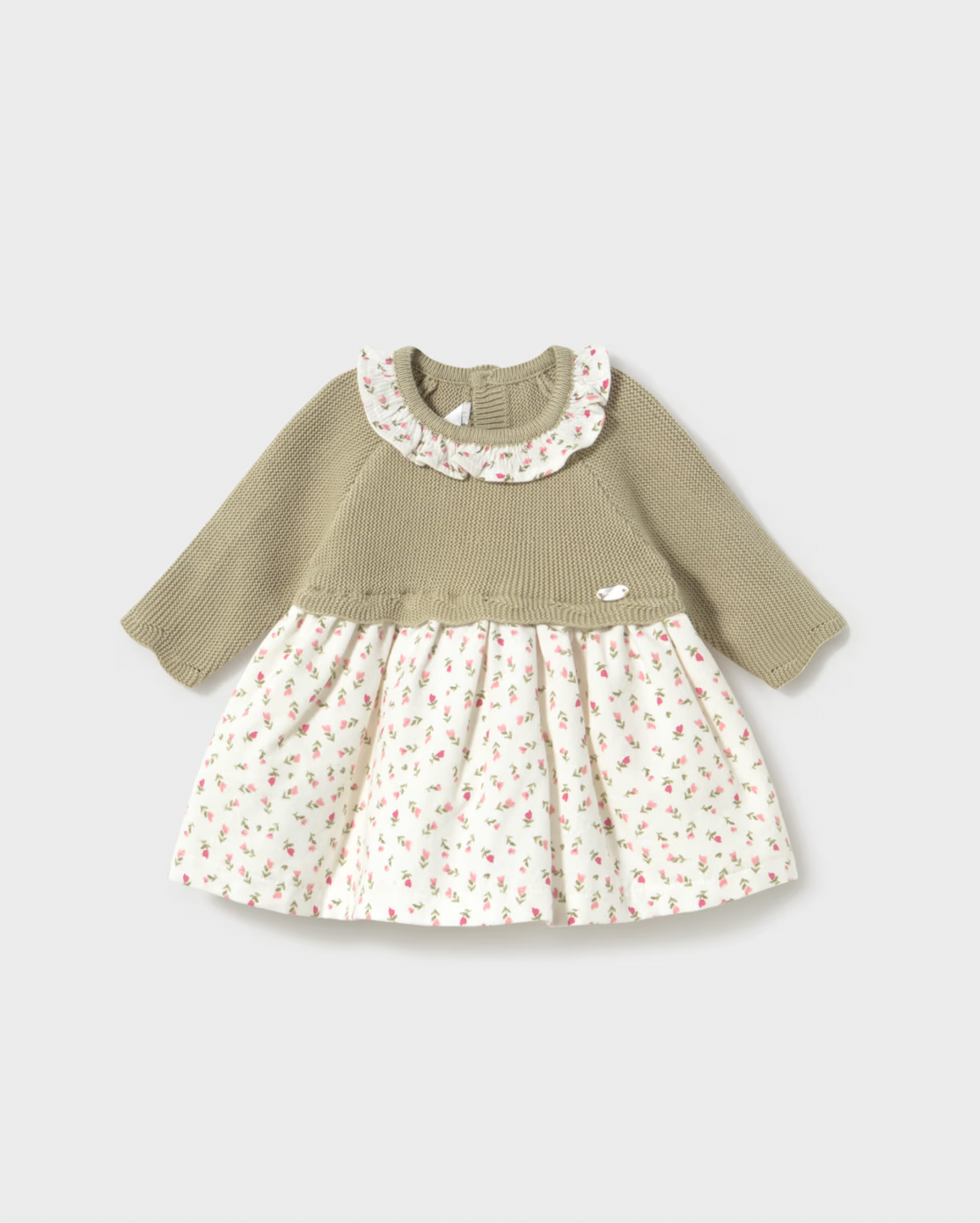 A baby girl's long-sleeve dress with a solid olive green ribbed knit top and a cream-colored skirt covered in a small pink and green floral print, set against a light gray background.