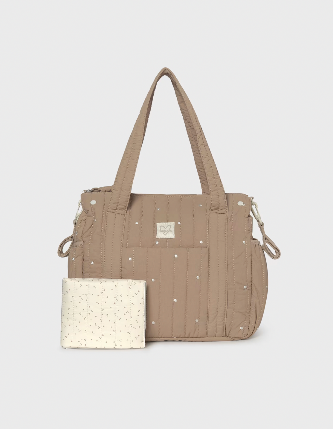 A beige quilted diaper bag with silver rhinestone accents and a matching cream-colored pouch with tiny gold speckles, displayed on a light gray background.
