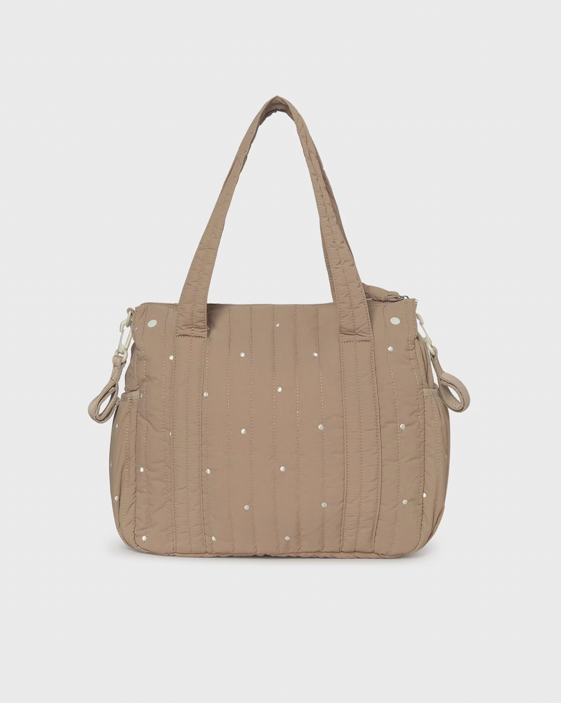 A taupe quilted puffer handbag with small white embroidered dots, dual top handles, and silver-tone hardware, shown against a light gray background.