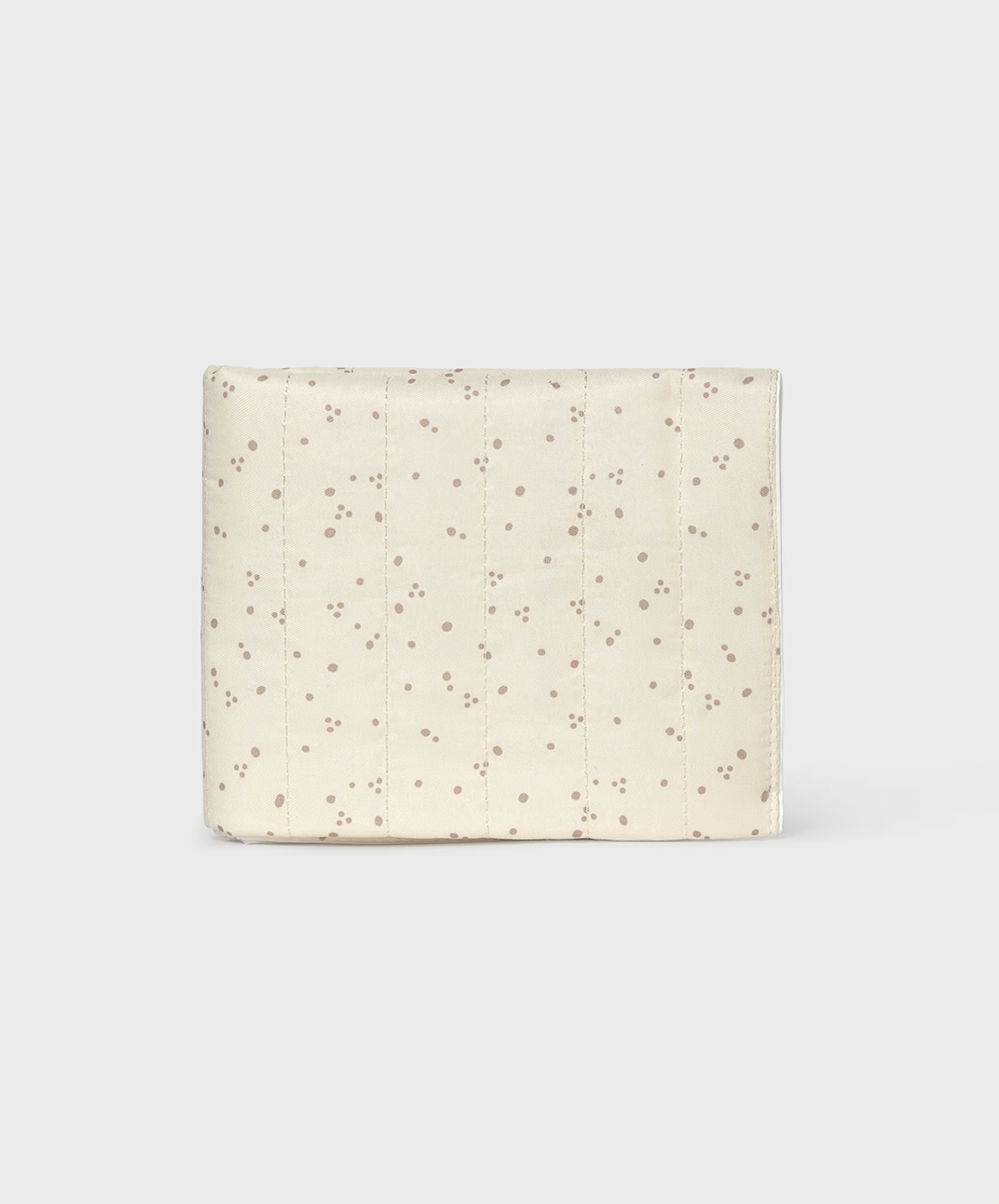 A cream-colored quilted fabric pouch with a delicate brown dotted pattern, shown against a light gray background.