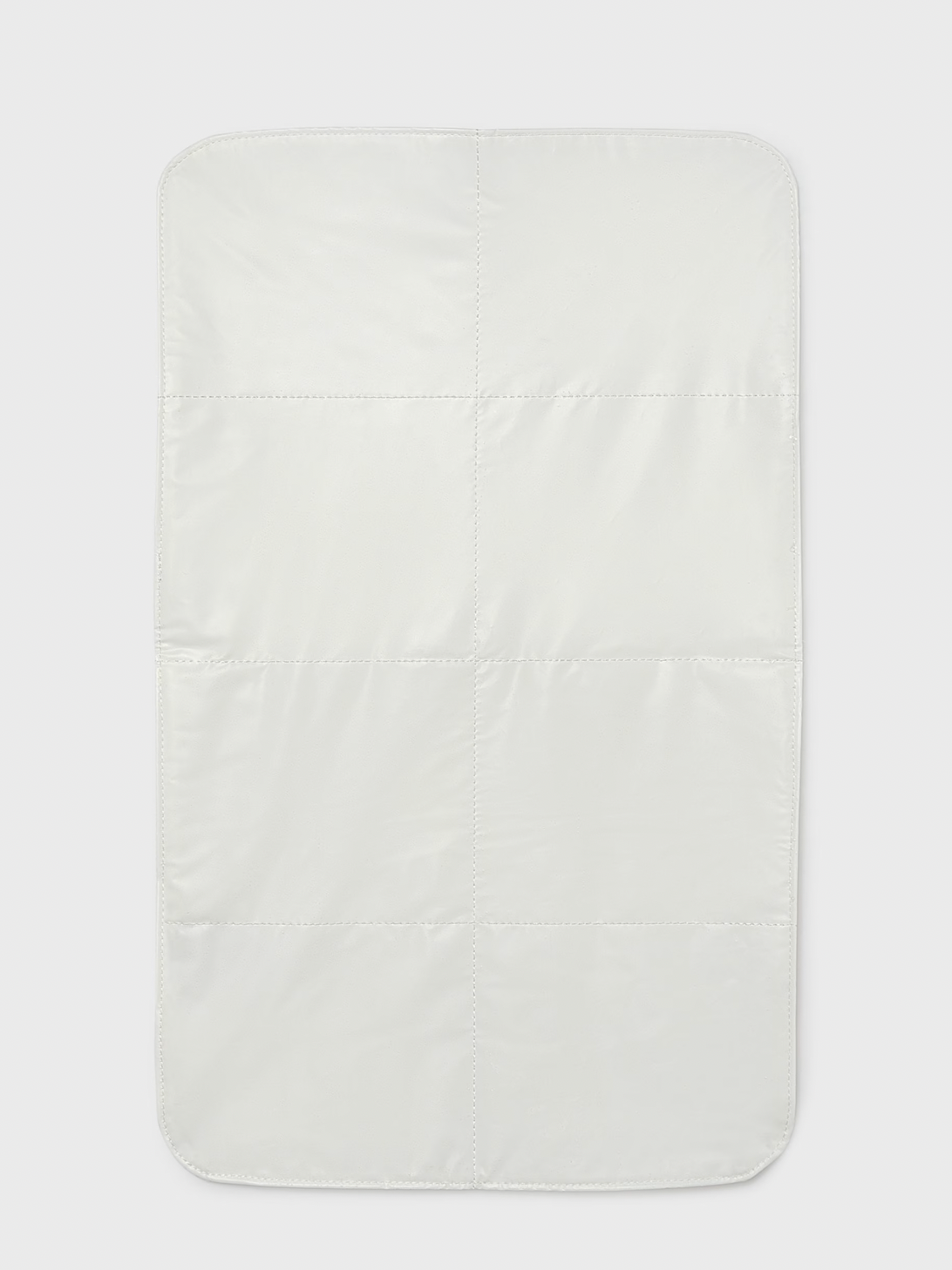 A rectangular white quilted baby changing pad with stitched grid sections, shown flat against a light gray background.