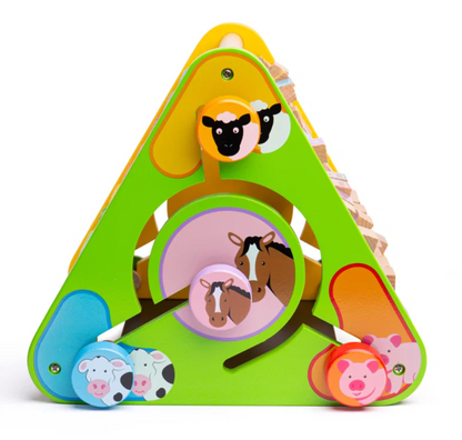 A colorful triangular wooden animal sorting toy with bright green, yellow, blue, pink, and orange sections, featuring animal cutouts and pull tabs for sheep, horse, cow, pig, and piglet on a white background.