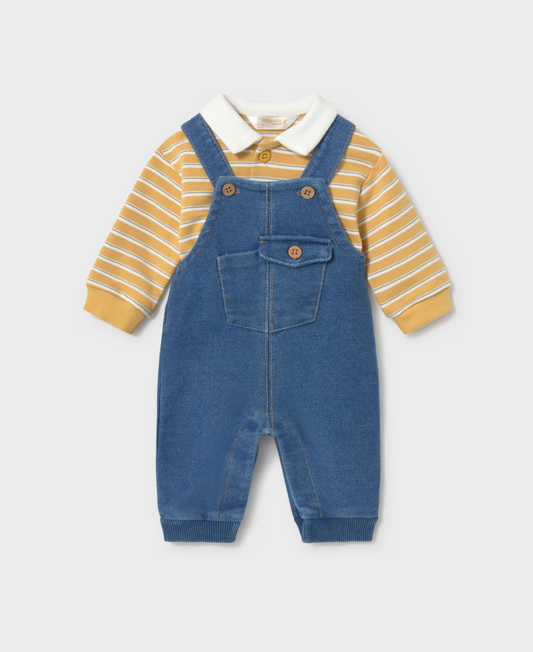 A baby boy's two-piece outfit featuring blue denim overall over a yellow and white striped long-sleeve polo shirt, displayed on a light gray background.