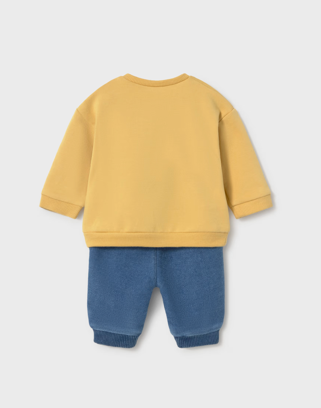 A baby clothing set shown from the back, featuring a mustard yellow long-sleeve sweatshirt and blue corduroy pants, laid flat on a light gray background.
