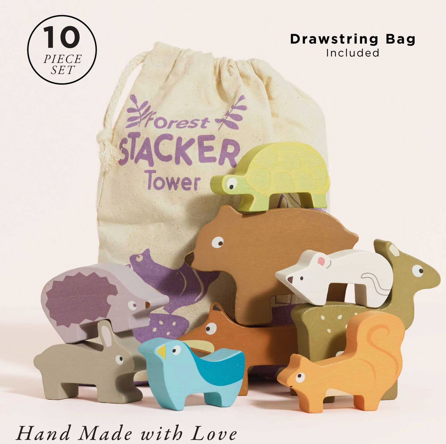 Le Toy Van Forest Stacking Wooden Animals set — "10 Piece Set" and "Drawstring Bag Included" labels; all 10 pieces shown with cotton drawstring bag printed "Forest Stacker Tower" in purple; "Hand Made with Love" text