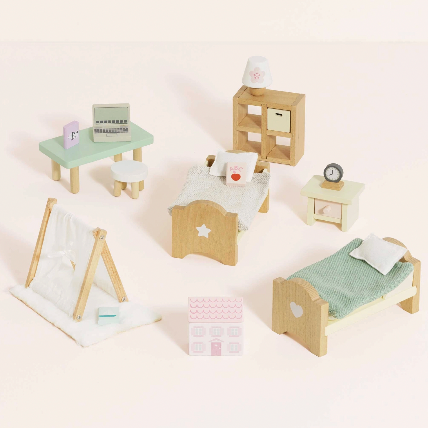 Le Toy Van 24-piece children's bedroom dolls house furniture set — all pieces shown together including two single beds with star and heart cut-out headboards, mint green desk with miniature laptop, bookshelf unit, teepee den, bedside table with alarm clock and pink dolls house toy box