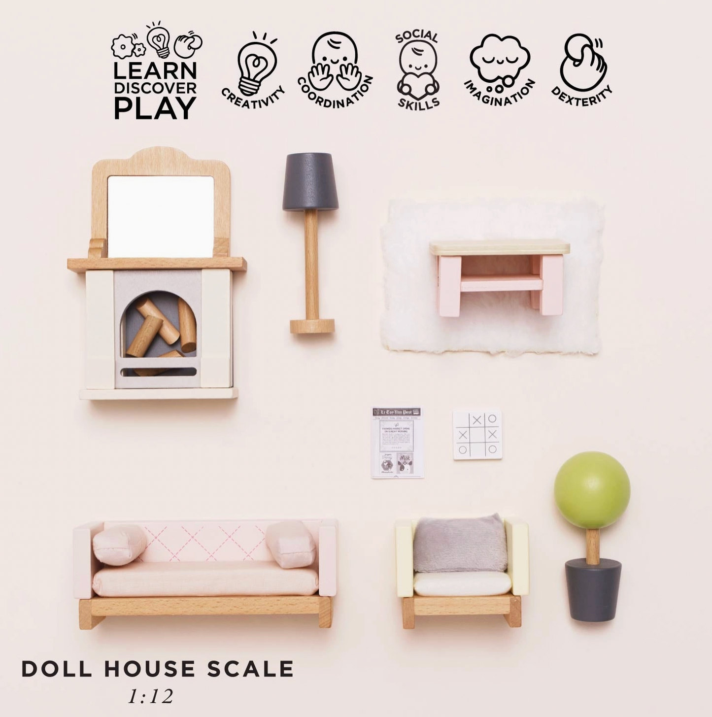 Le Toy Van sitting room dolls house furniture set — flat lay showing all pieces individually with "Doll House Scale 1:12" label and play skills icons for creativity, coordination, social skills, imagination and dexterity; includes fireplace with logs, floor lamp, side table, sofa, armchair, coffee table, miniature newspaper, chessboard and topiary