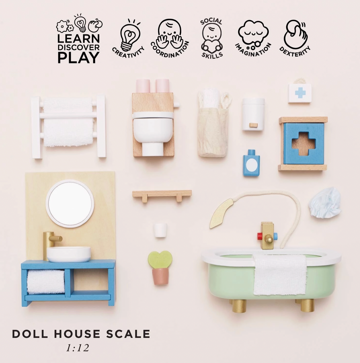 Le Toy Van wooden bathroom dolls house furniture set — flat lay of all pieces with "Doll House Scale 1:12" label and play skills icons for creativity, coordination, social skills, imagination and dexterity; includes roll-top bath, vanity unit, toilet, towel rail, first aid cabinet, shampoo bottle, toothbrush cup, bath mat and bath puff