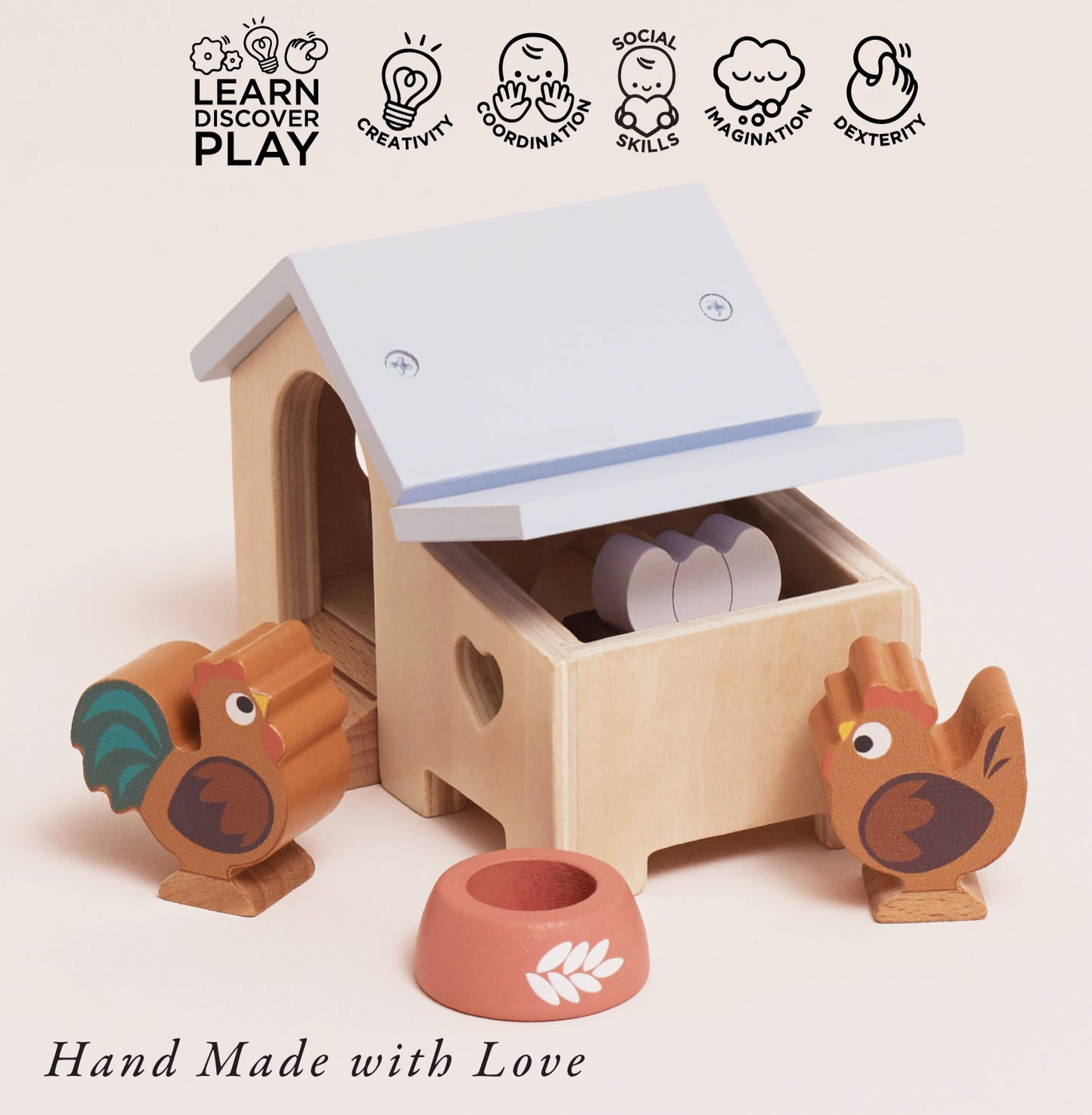 Le Toy Van wooden chicken coop set — styled scene with "Hand Made with Love" and play skills icons for creativity, coordination, social skills, imagination and dexterity; showing the lift-off roof open to reveal the nesting box compartment with eggs inside, rooster and hen figures and terracotta food bowl