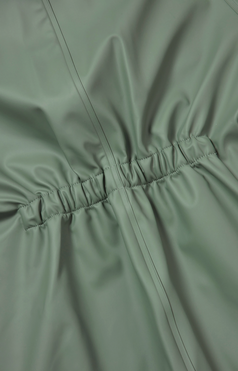 Grass & Air children's waterproof puddle suit — close-up detail of the elasticated back panel at the waist, showing the gathered elastication for shape and comfortable fit