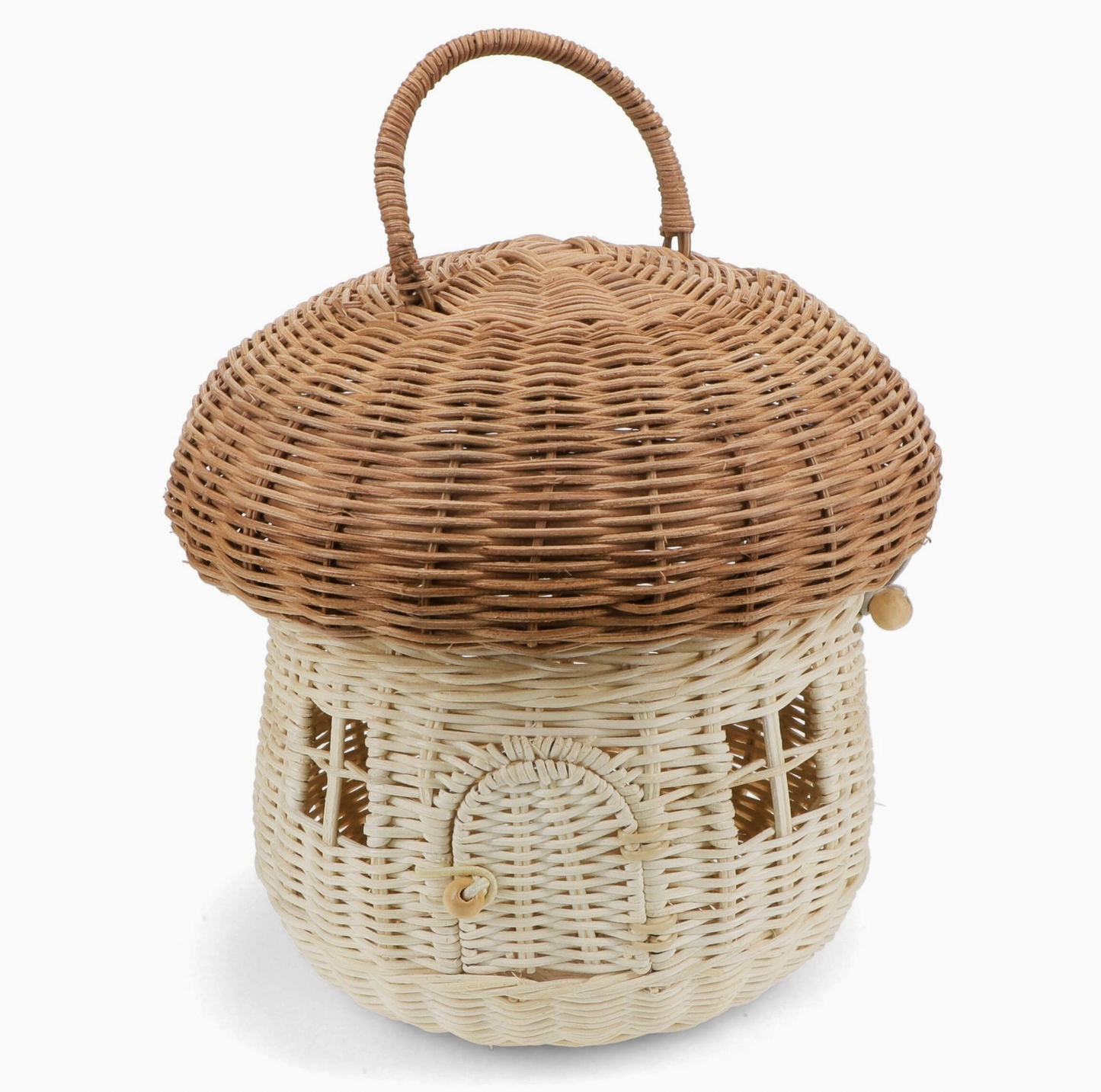 Rex London Wonders of Nature rattan mushroom house decorative basket — front view showing the two-tone design with warm honey-brown domed woven cap with looped rattan carry handle, and pale cream woven body with woven lattice window details and arched doorway with wooden bead button closure; elastic loop and wooden bead cap fastening visible on the side; 22cm diameter