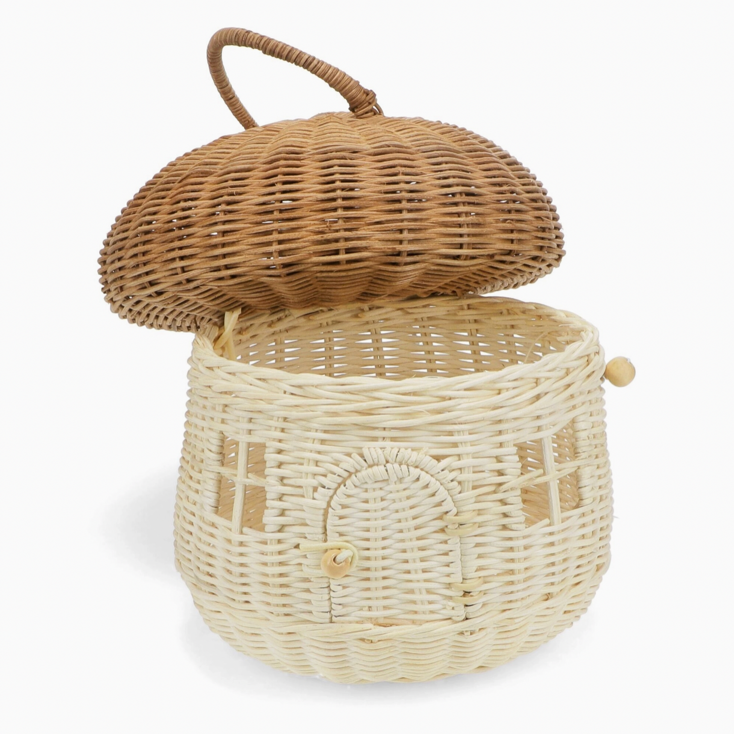 Rex London Wonders of Nature rattan mushroom house decorative basket — open view with the honey-brown domed cap lifted off and tilted to the side, revealing the generous open storage basket interior; pale cream woven body with arched doorway and wooden bead closure visible
