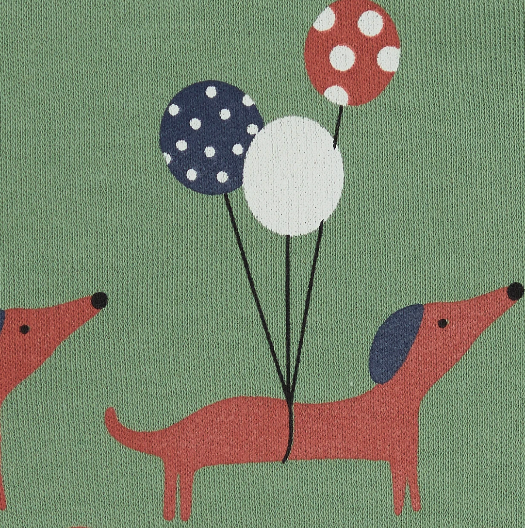 Close-up — balloon trio detail (navy polka dot, plain white, red polka dot); two dogs in trotting poses; jersey fabric texture visible. 