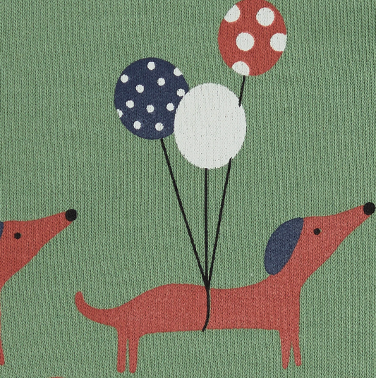 Close-up — balloon trio detail (navy polka dot, plain white, red polka dot); two dogs in trotting poses; jersey fabric texture visible. 