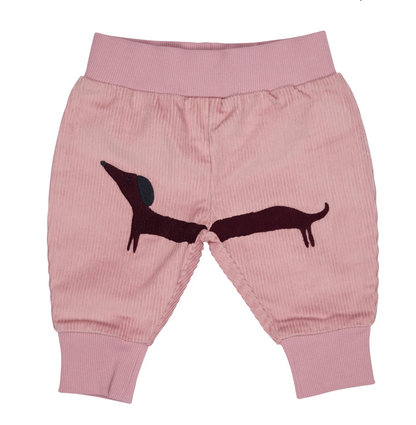 Front flat — blush fine-wale cord; large spanning plum dachshund embroidery across both legs; deep ribbed waistband; harem silhouette; ribbed ankle cuffs.