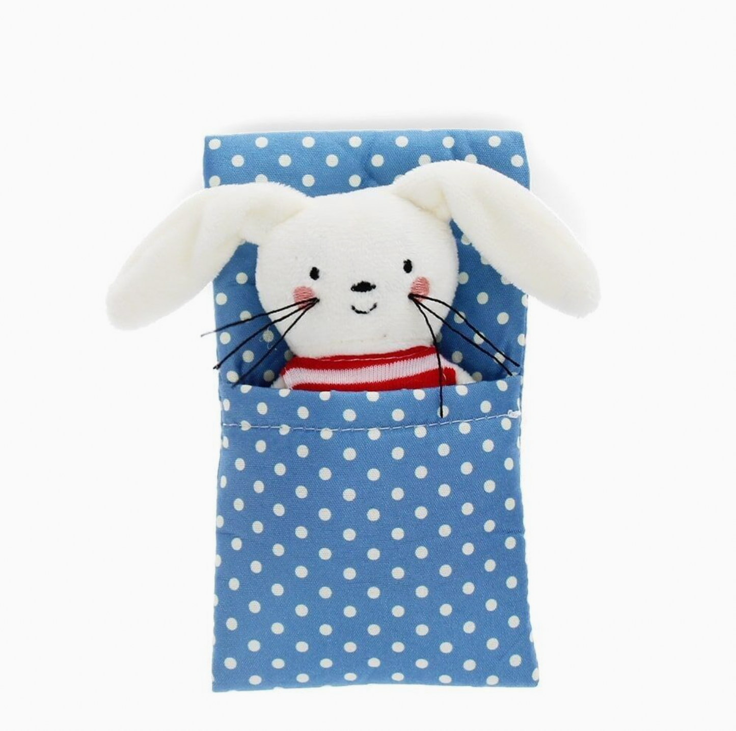  Bunny out of box in blanket; overhead flat-lay; white plush with floppy ears, pink blush cheeks, black whiskers, red and white striped top; tucked into blue polka dot pocket blanket