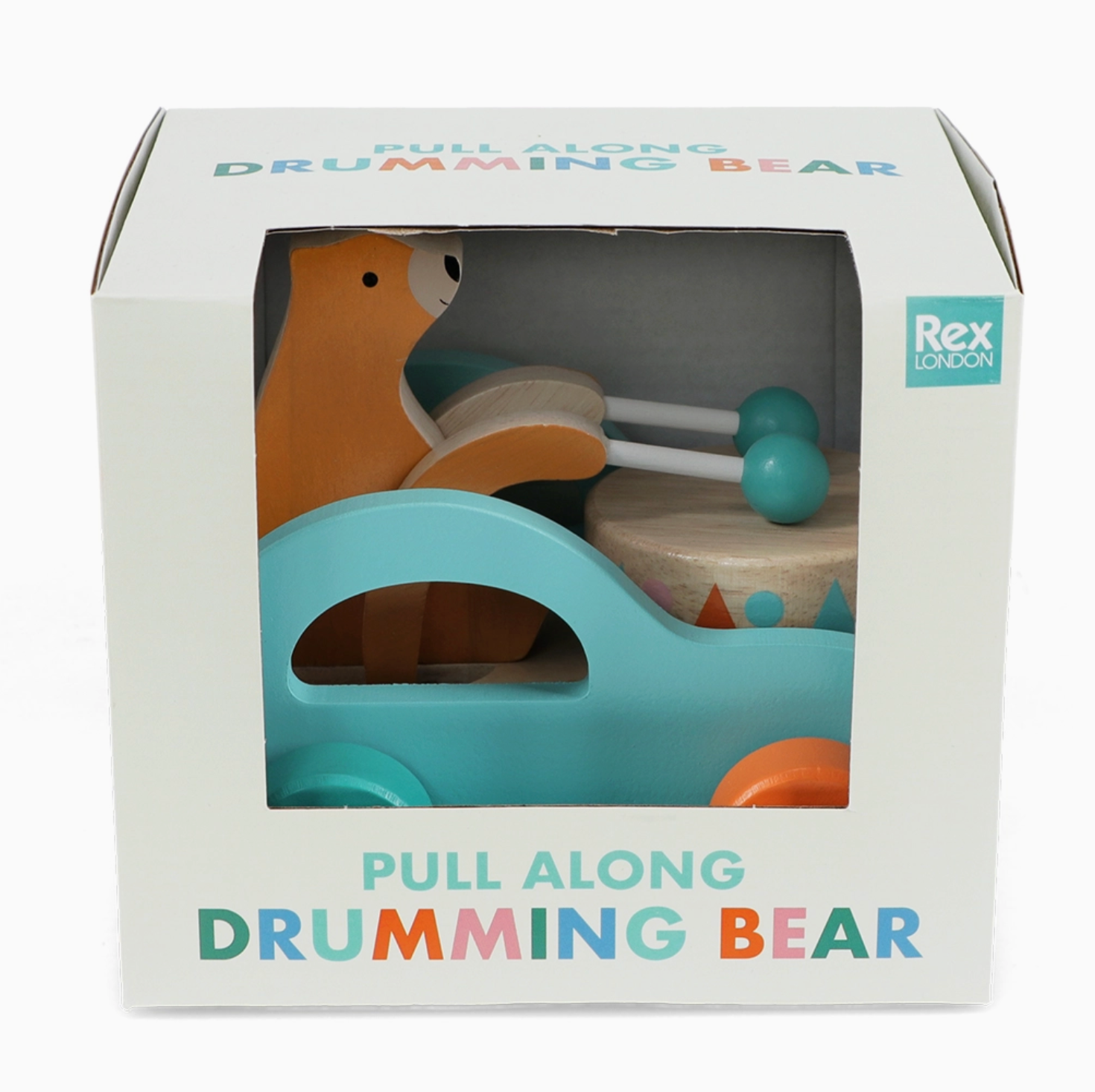 Toy in box; white gift box with display window; multicolour "Pull Along Drumming Bear" lettering; toy visible through window; Rex London logo