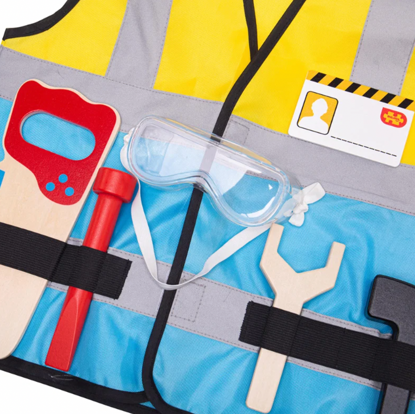 Close-up — vest front panels; all tools in loops; ID badge in chest pocket; goggles and spanner right panel