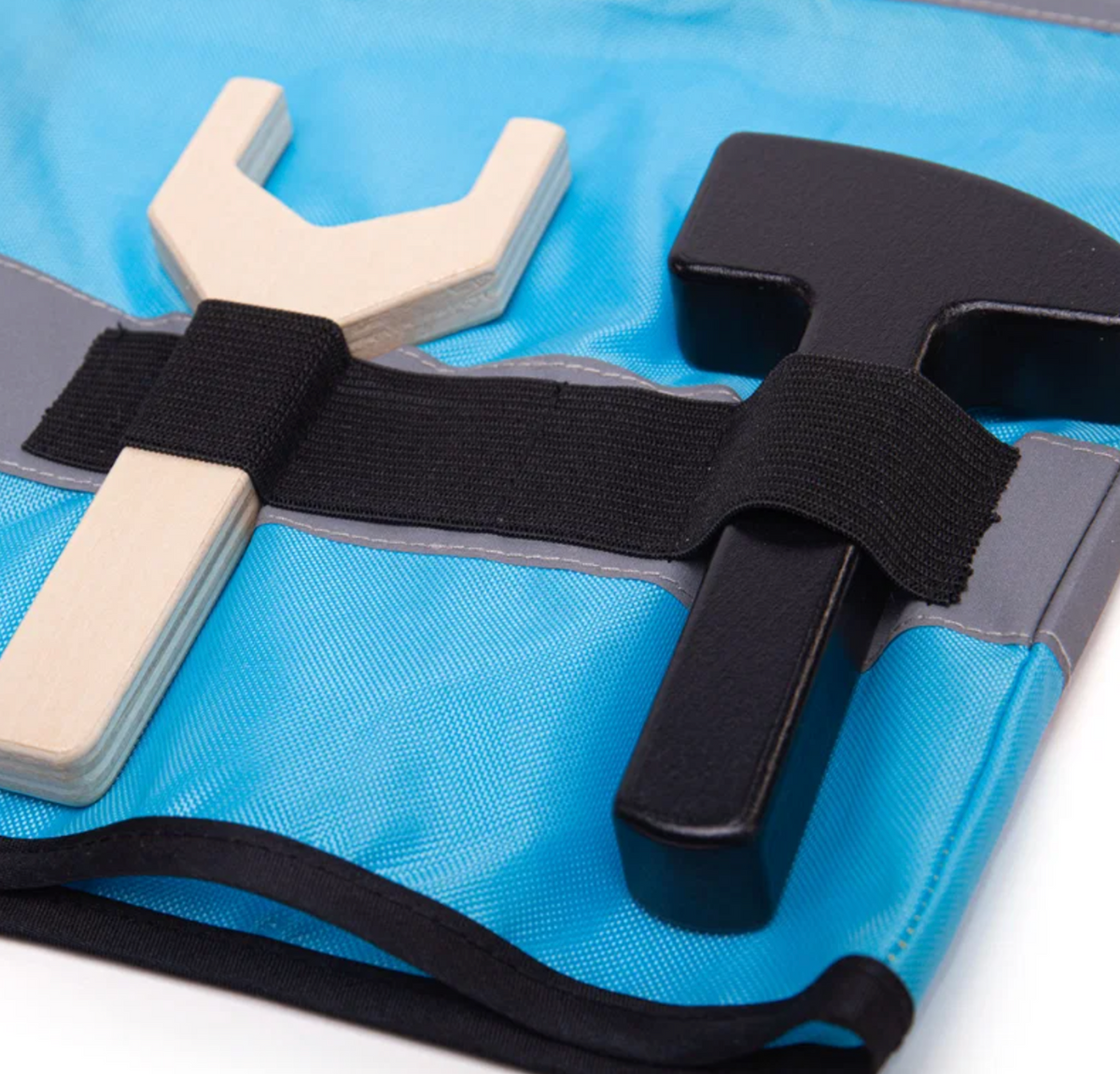 Close-up — right panel; natural beech spanner and black-headed hammer in elastic loops 