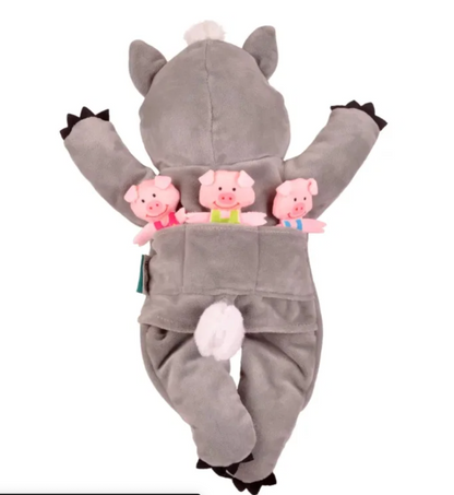 Wolf rear — white fluffy tail, wide back pocket with all three pigs stored upright; black claw tips on feet; Fiesta Crafts label visible
