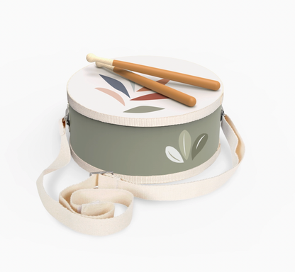 Straight-on 3/4 product shot — drum body, hoops, strap detail and drumsticks from a slightly lower angle