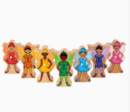 All 7 fairies in rainbow row on white; red, orange, yellow, green, blue, purple, pink; diverse skin tones; individual wing and outfit designs