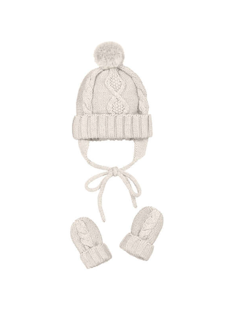 Mayoral Baby Hat and Mitten Set on a white background; warm cream cable knit baby hat with fluffy round pompom on top; raised central cable knit pattern running vertically from ribbed turn-up brim to crown; ribbed turn-up brim at the base of the hat in matching cream; ear flaps on both sides extending down from the hat; two long cream knit tie strings hanging down from the ear flaps for tying under the chin; pair of matching baby mittens displayed below the hat, left and right mitten side by side; matching 