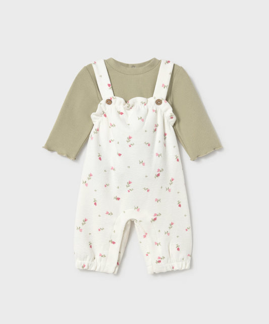 Front view on grey — full set, scalloped bib frill, frilled ankle cuffs, complete silhouette