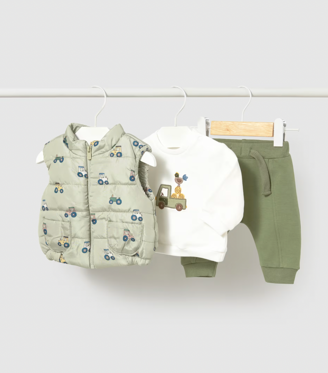 White BG flat lay — all 3 pieces separate; embroidered top, olive joggers, tractor print gilet