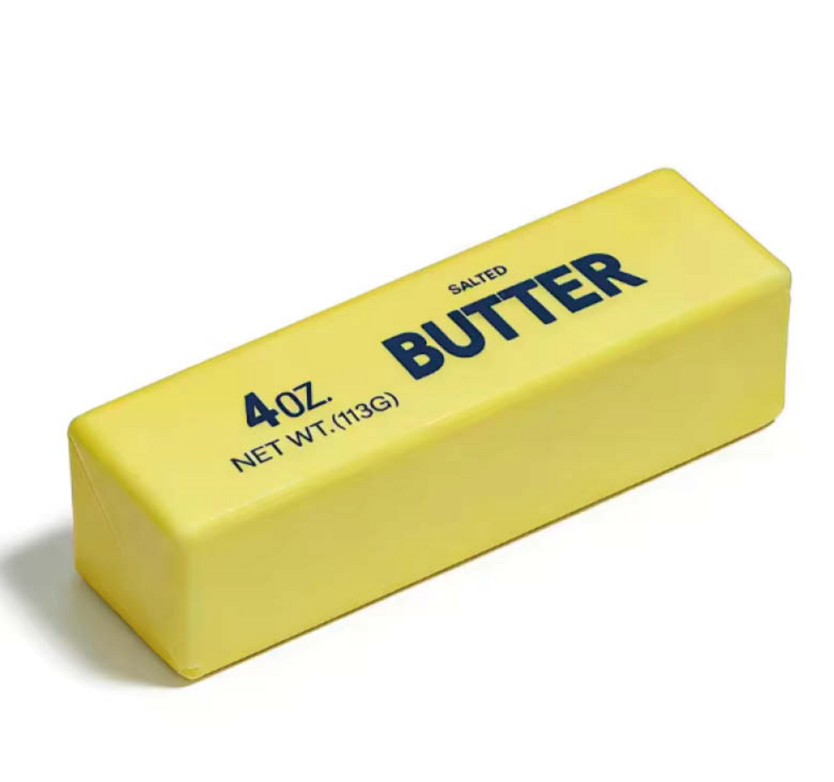 Super Star Butter Squishy slow-rising squishy toy on a white background; the toy is a rectangular block with gently rounded edges and corners in bright butter-yellow soft foam, designed to look exactly like a real block of salted butter; the top face of the block has bold navy blue sans-serif text reading SALTED above and BUTTER in large capitals below; the right-hand long face has bold navy text reading 4 OZ. on the left and NET WT. (113G) below it; the surface is smooth and slightly matte with a soft tact