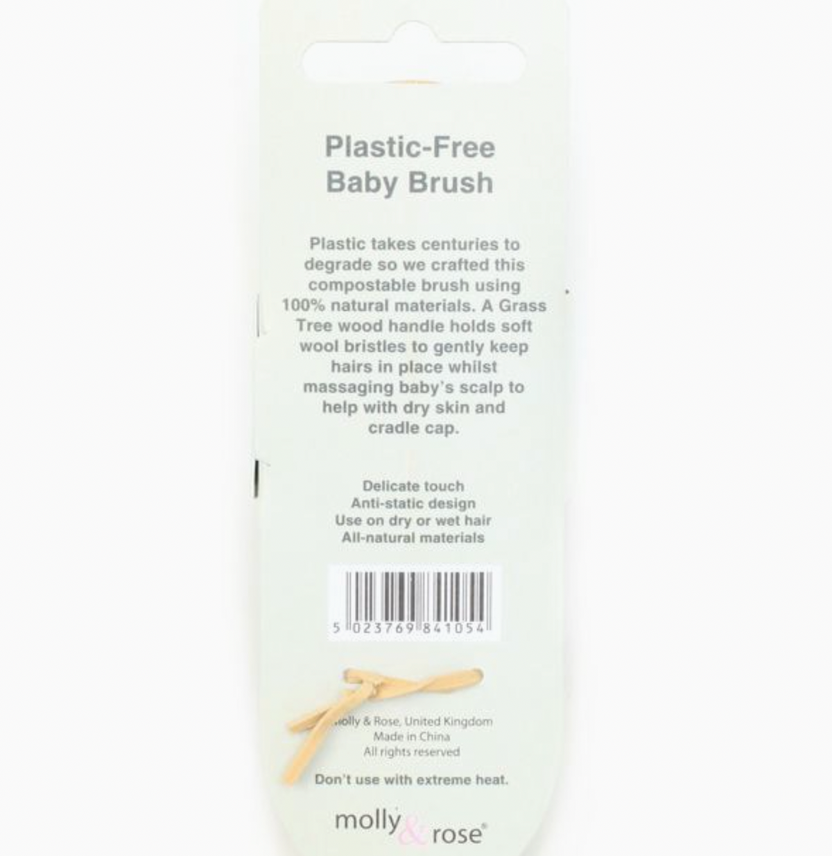 Reverse of the Molly and Rose Plastic Free Baby Brush retail packaging on a white background; white card back printed in grey text with the brand description, four bullet points — Delicate touch, Anti-static design, Use on dry or wet hair, All-natural materials — a barcode, and the Molly and Rose brand name in lowercase serif type at the bottom
