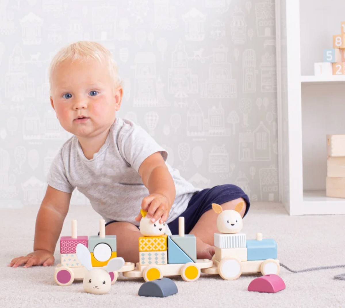 Bigjigs activity pull-along train toy; wooden toddler toy suitable from 12 months and measuring approximately 38.6cm wide