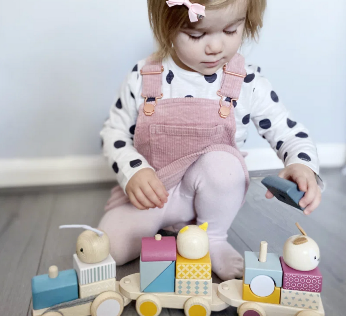Bigjigs Toys pull-along wooden train for toddlers; colourful activity toy for early walking and imaginative play