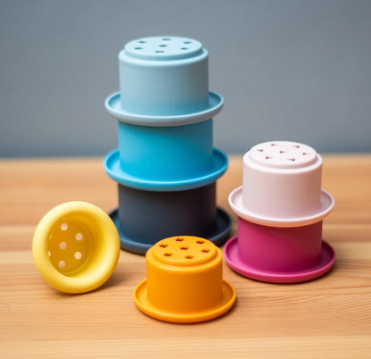Bigjigs stacking cups activity toy; suitable for children aged 12 months and over and designed for early learning through play