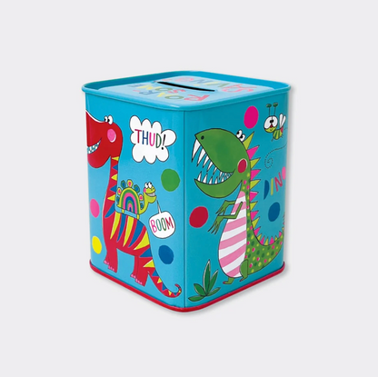Child saving coins in a Rachel Ellen dinosaur money box, with the blue illustrated tin held in the foreground and other money boxes nearby