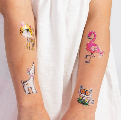 Pink flamingo temporary tattoo with gold foil detail applied to a child's forearm from the Rachel Ellen Love Our Planet collection