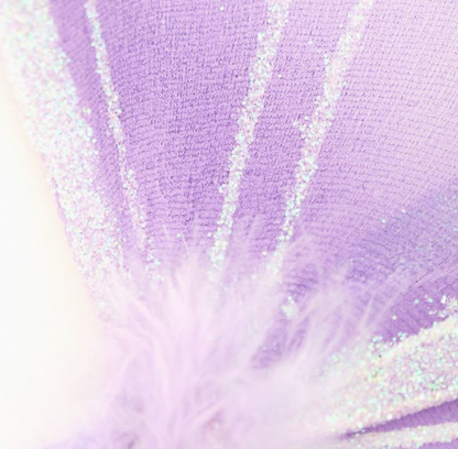Close-up of Molly & Rose fairy wings showing lilac mesh texture, white vein detailing, frosty glitter and a soft gathered centre