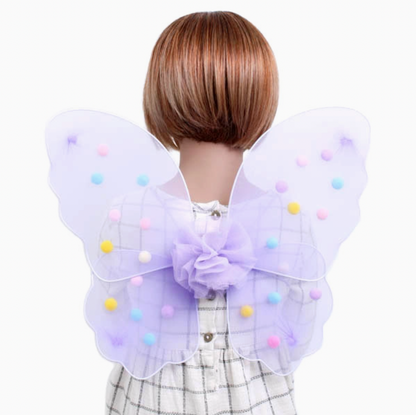 Lilac Molly & Rose Pom Pom Fairy Wings packaged in a clear PP bag with a floral Molly & Rose header card; colourful pompoms and elastic straps visible