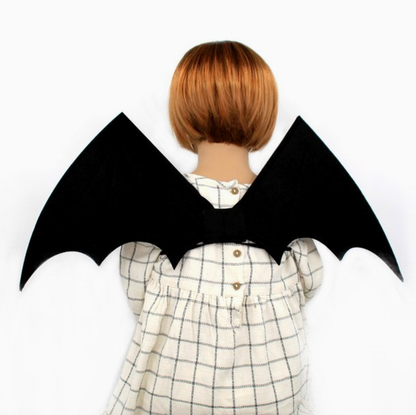 Molly & Rose black fabric bat wings laid flat on a white background; pair has pointed tips, scalloped lower edges, stitched panel lines and black elasticated straps
