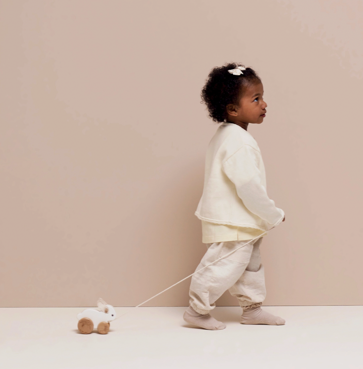 Wooden Le Toy Van rabbit pull-along toy made with FSC®-certified wood and soft felt ears, designed to encourage confident first steps.