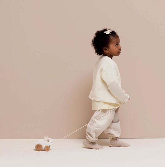 Wooden Le Toy Van rabbit pull-along toy made with FSC®-certified wood and soft felt ears, designed to encourage confident first steps.