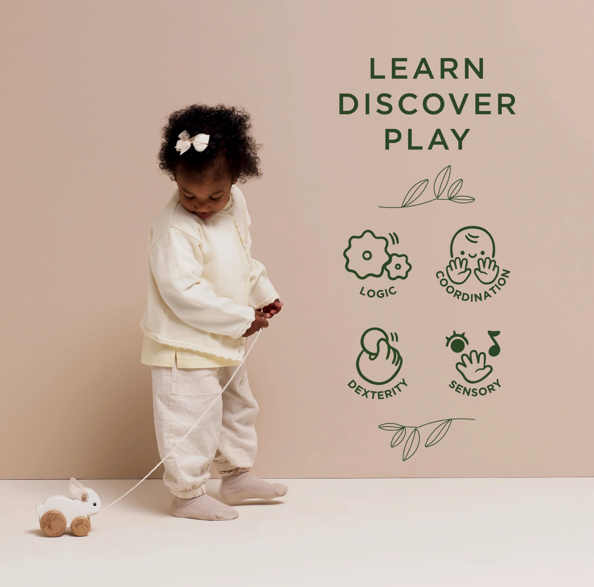 Le Toy Van wooden Pull Along Rabbit for babies and toddlers, with soft felt ears and a hopping action to support early walking play.