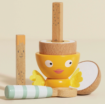 Pretend-play breakfast set from Le Toy Van with wooden egg and spoon, two hand-painted toast soldiers, and a stitched felt-wing egg cup.