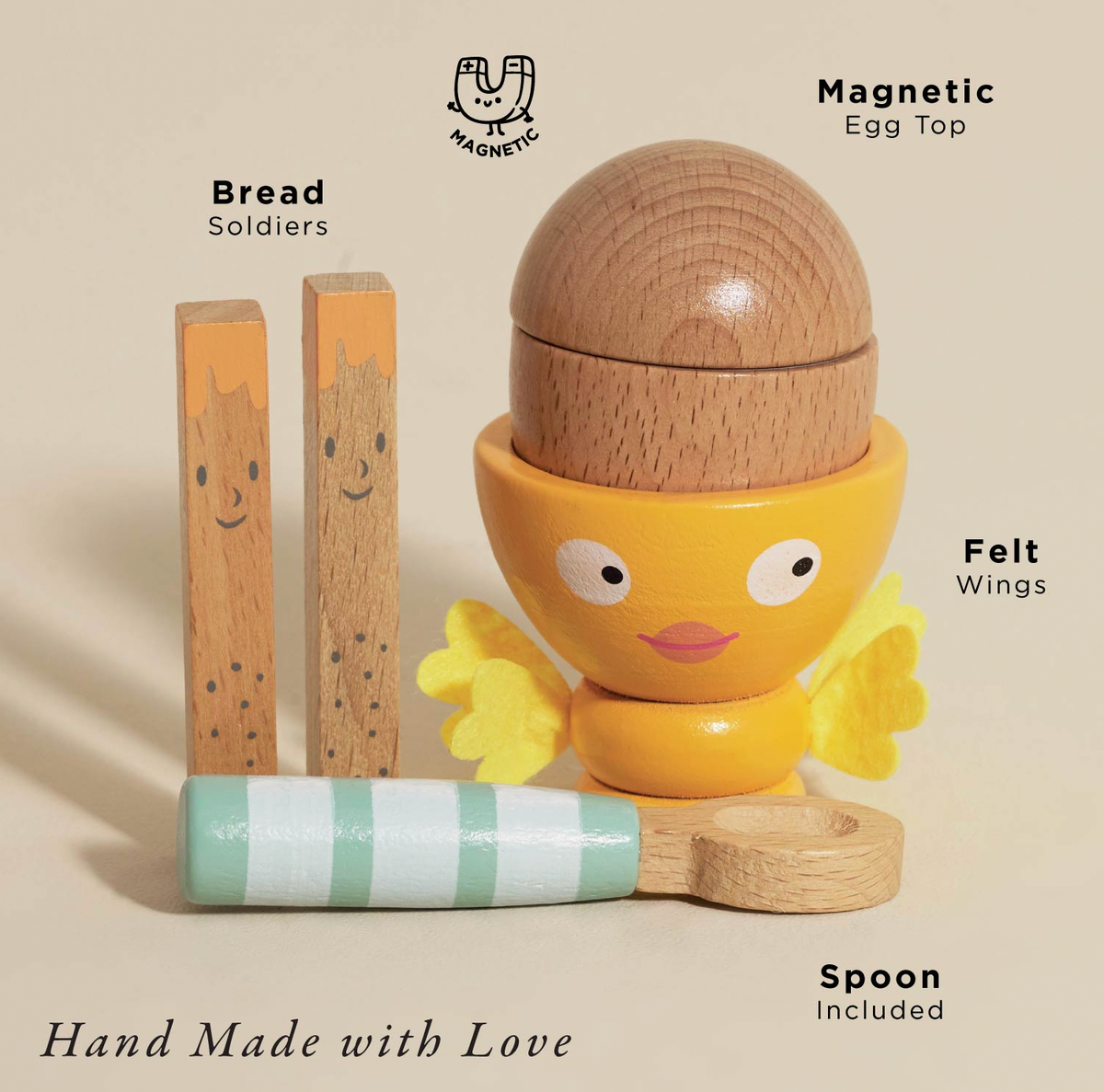 Wooden play food set by Le Toy Van: egg cup with stitched felt wings, magnetic egg, two painted toast soldiers and a wooden spoon.