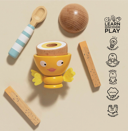 Le Toy Van six-piece Wooden Egg Cup & Soldiers set for pretend kitchen play, including a magnetic egg, toast soldiers, spoon and felt-wing cup.