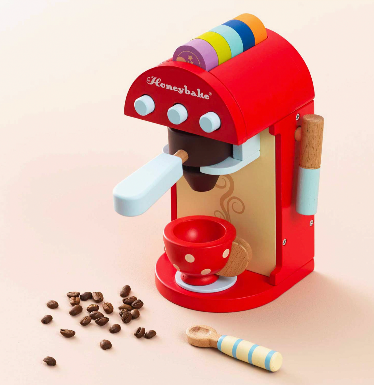 Award-winning wooden coffee machine toy from Le Toy Van with removable portafilter, milk frother, painted cup and stirring spoon.