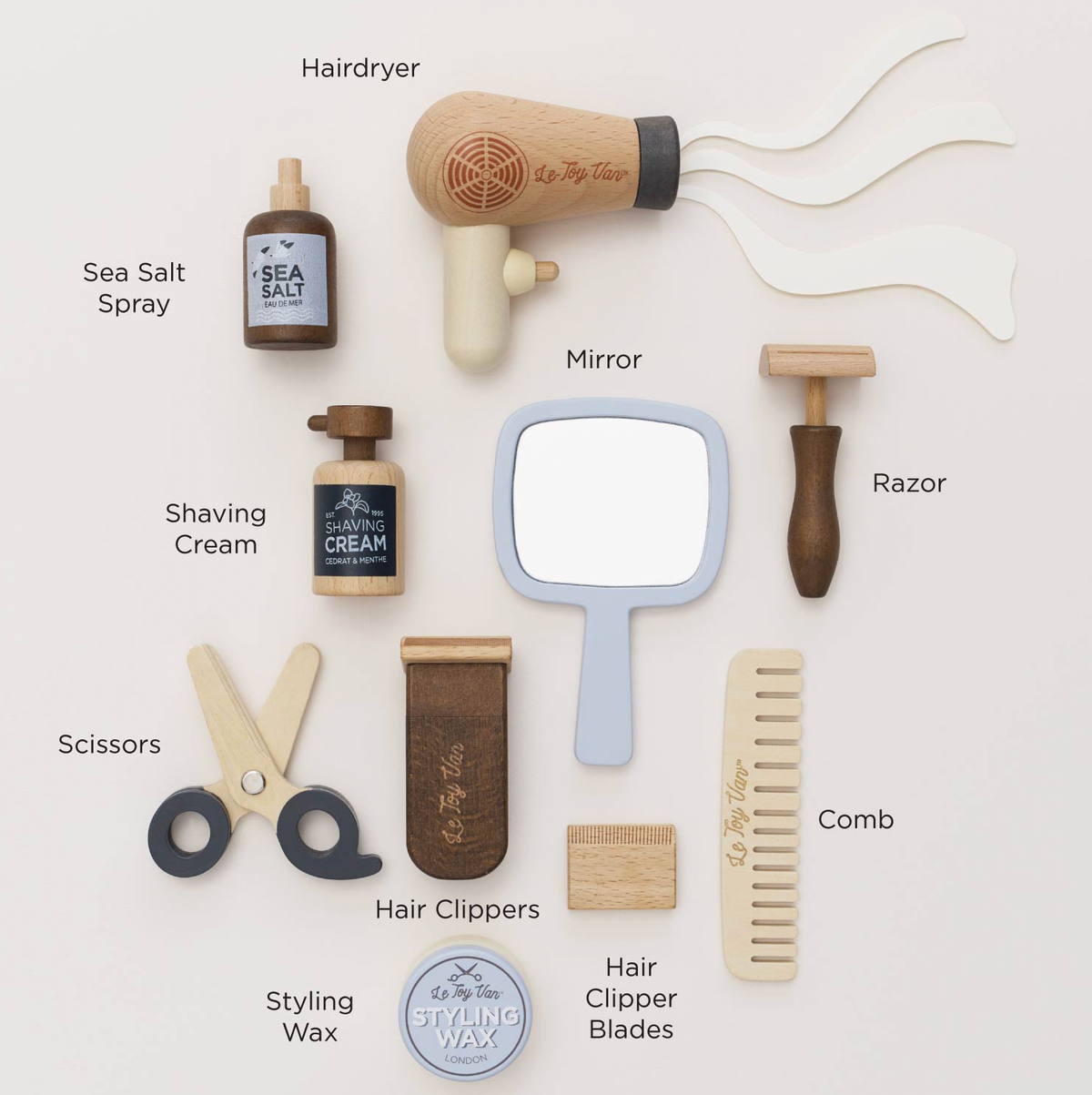 Le Toy Van pretend-play barber and hairdresser kit with 12 grooming accessories and a cotton bag for storage.