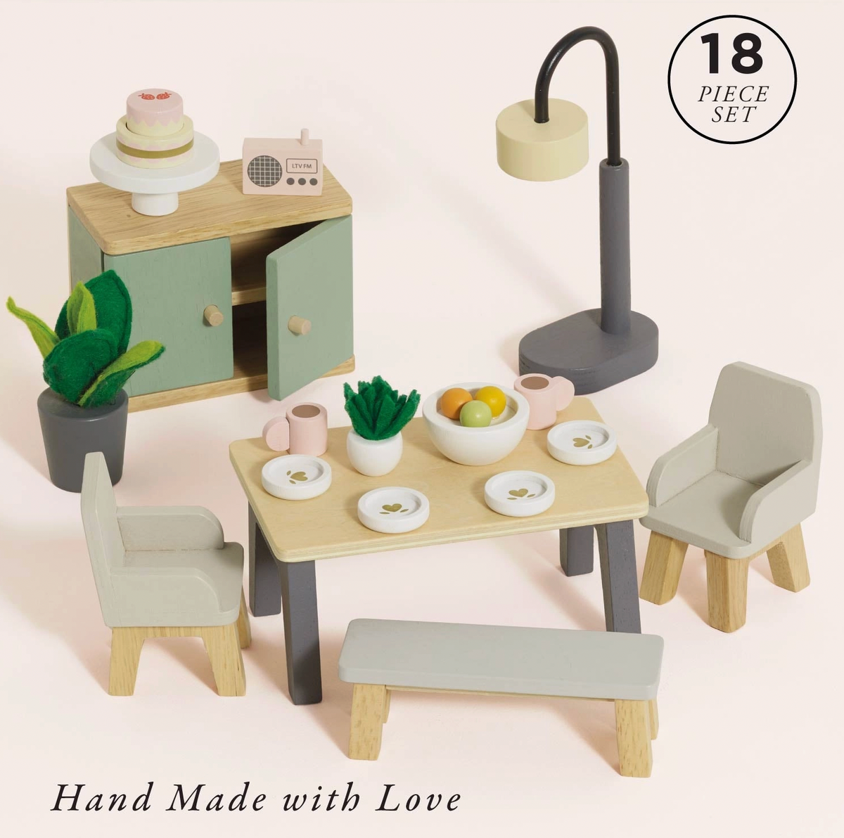 Contemporary-style 18-piece dolls' house dining room furniture set by Le Toy Van, crafted from wood for miniature play.⠋